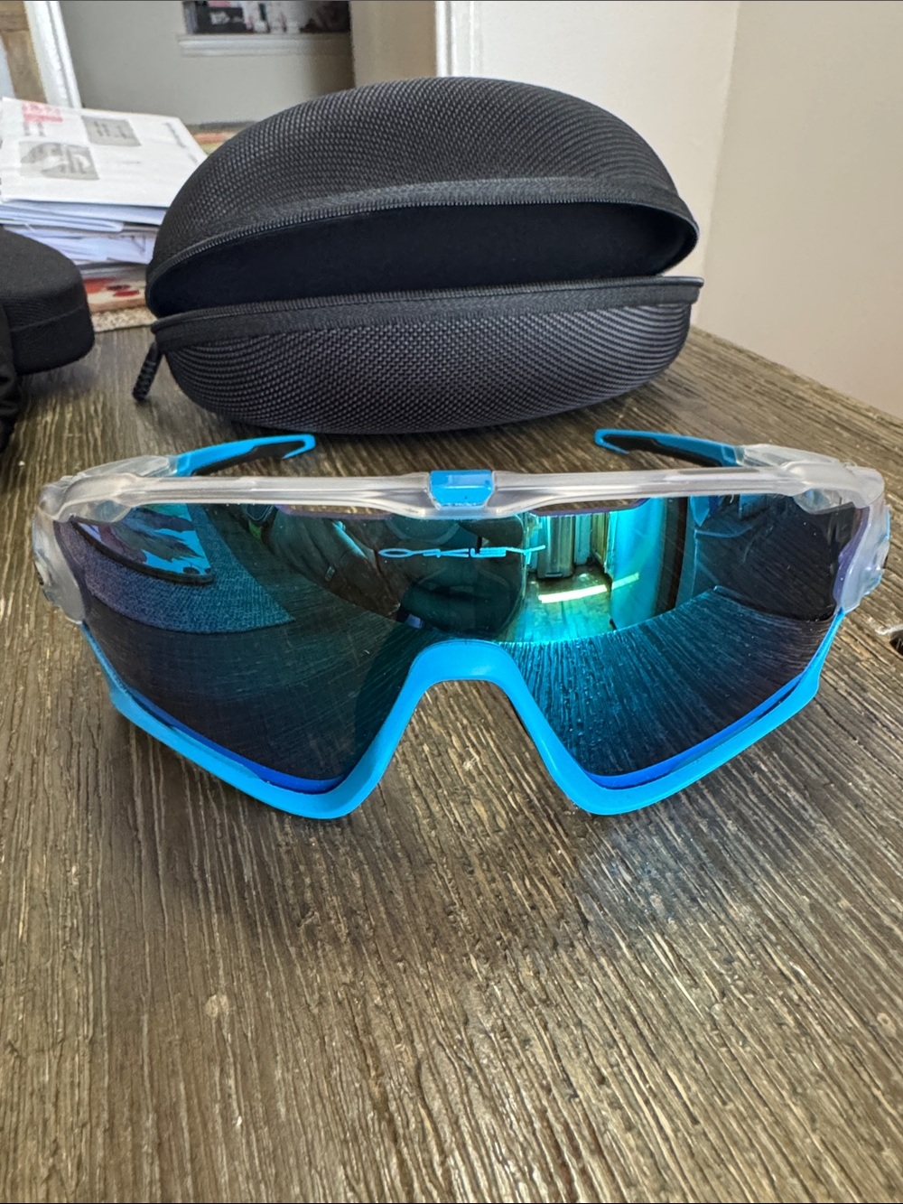 Oakley Men's Clear Frame Blue Trim Mirrored Lens Sports Sunglasses